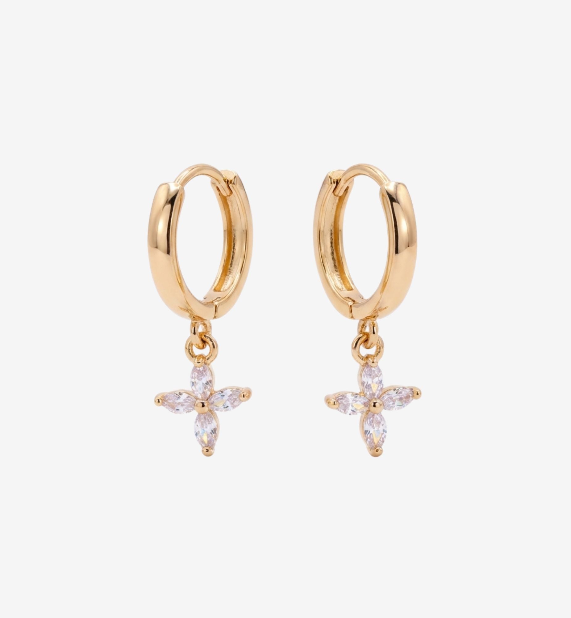 Gold hoop earrings with star-shaped charms on a white background