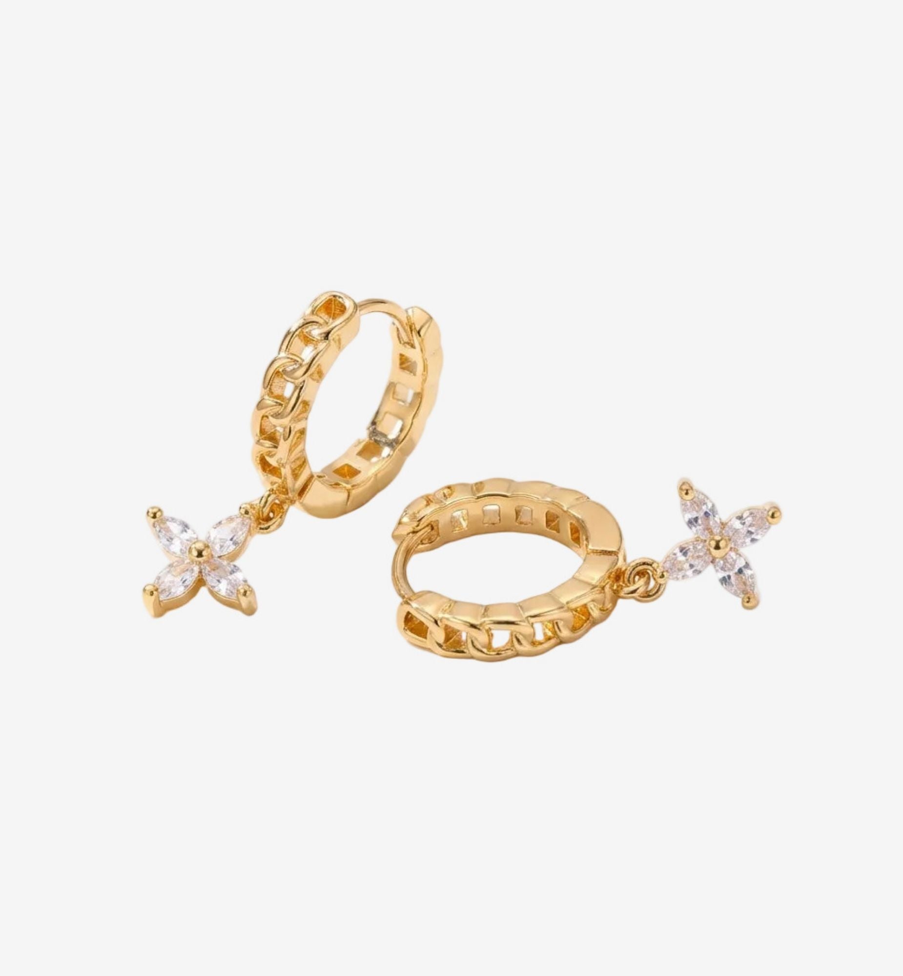 Gold hoop earrings with star-shaped gemstones on a white background