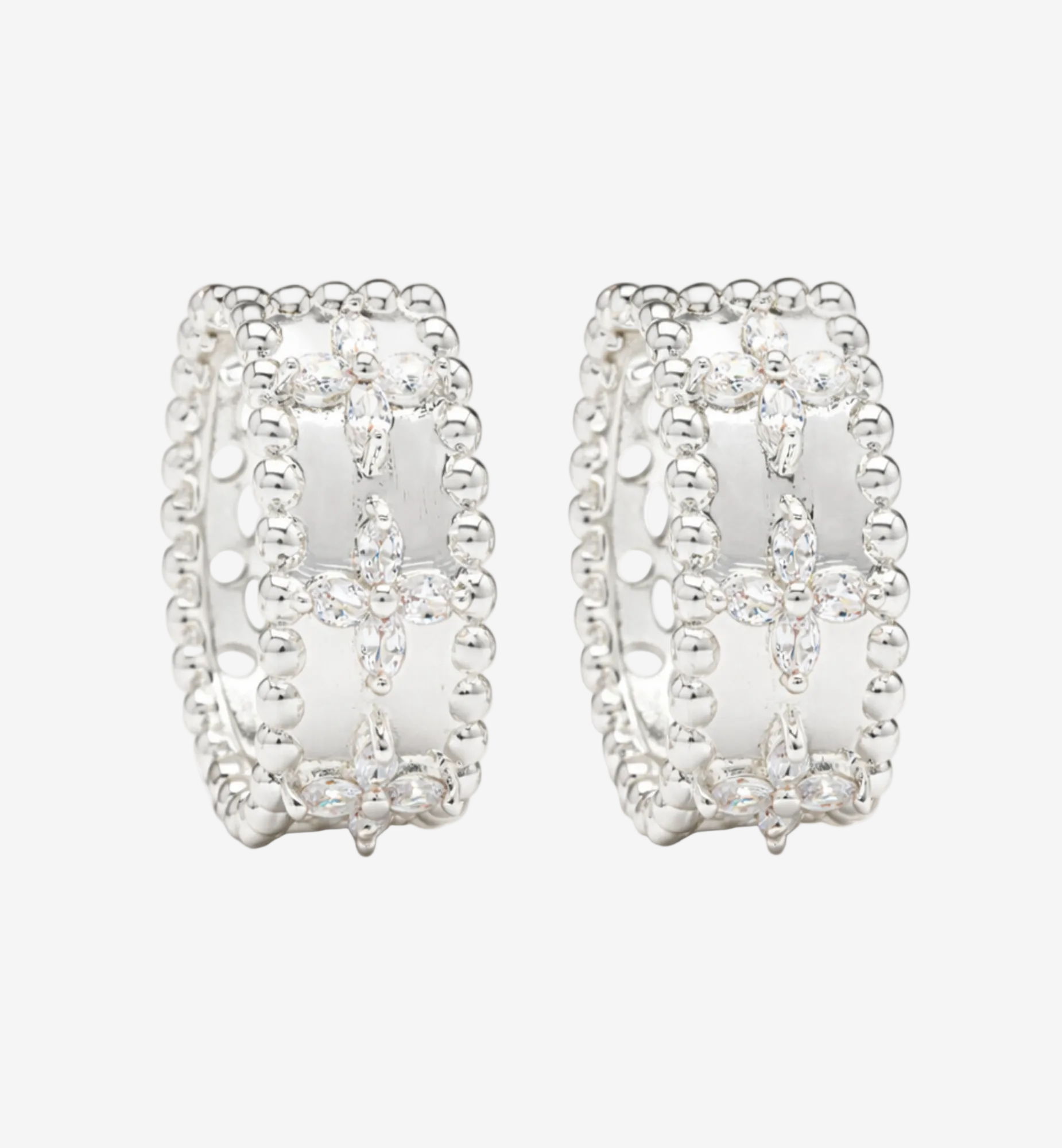Pair of silver hoop earrings on a white background