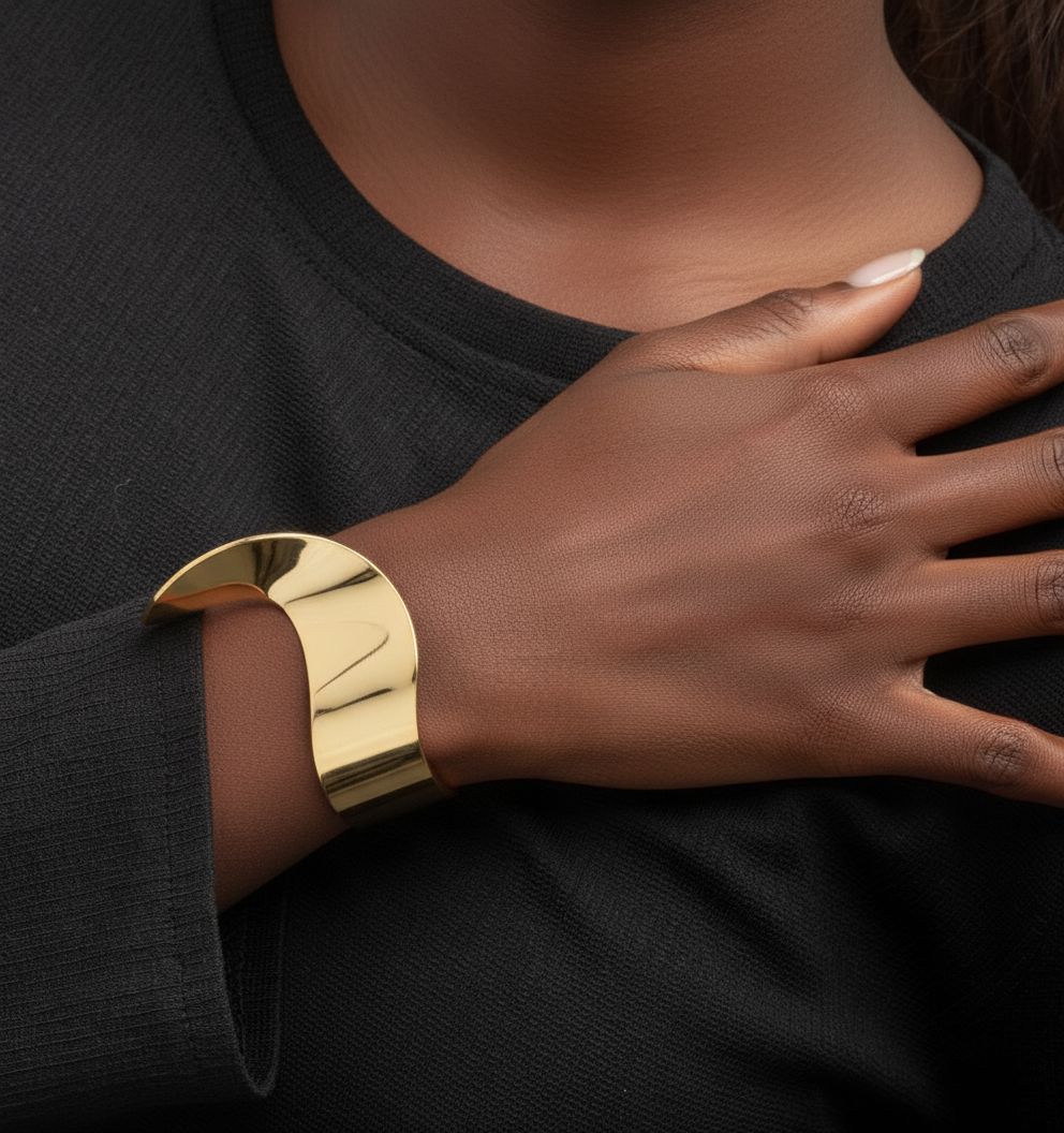 gold wave bangle 18k gold plated on a black background top