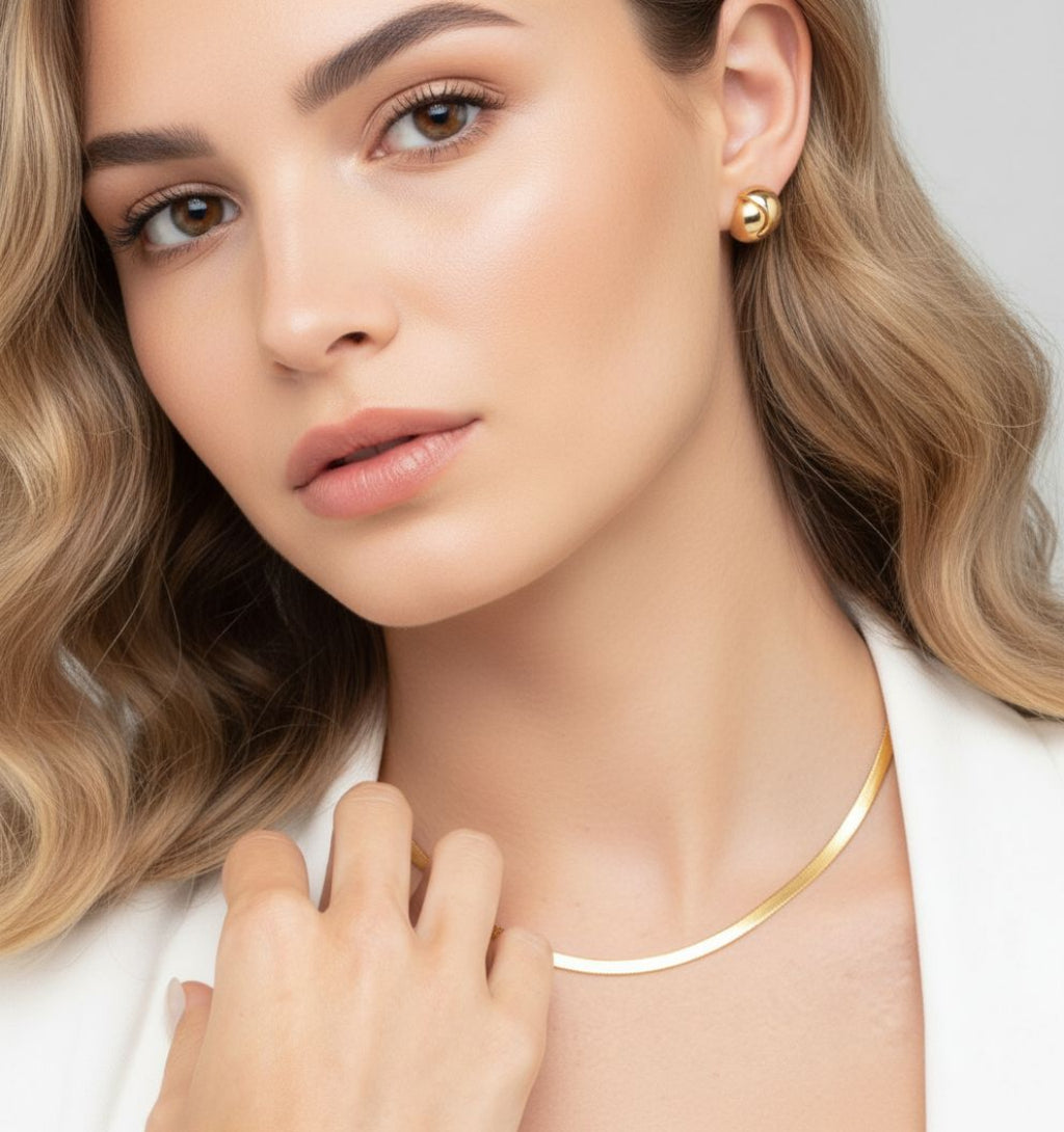 women wearing knot gold stud earrings