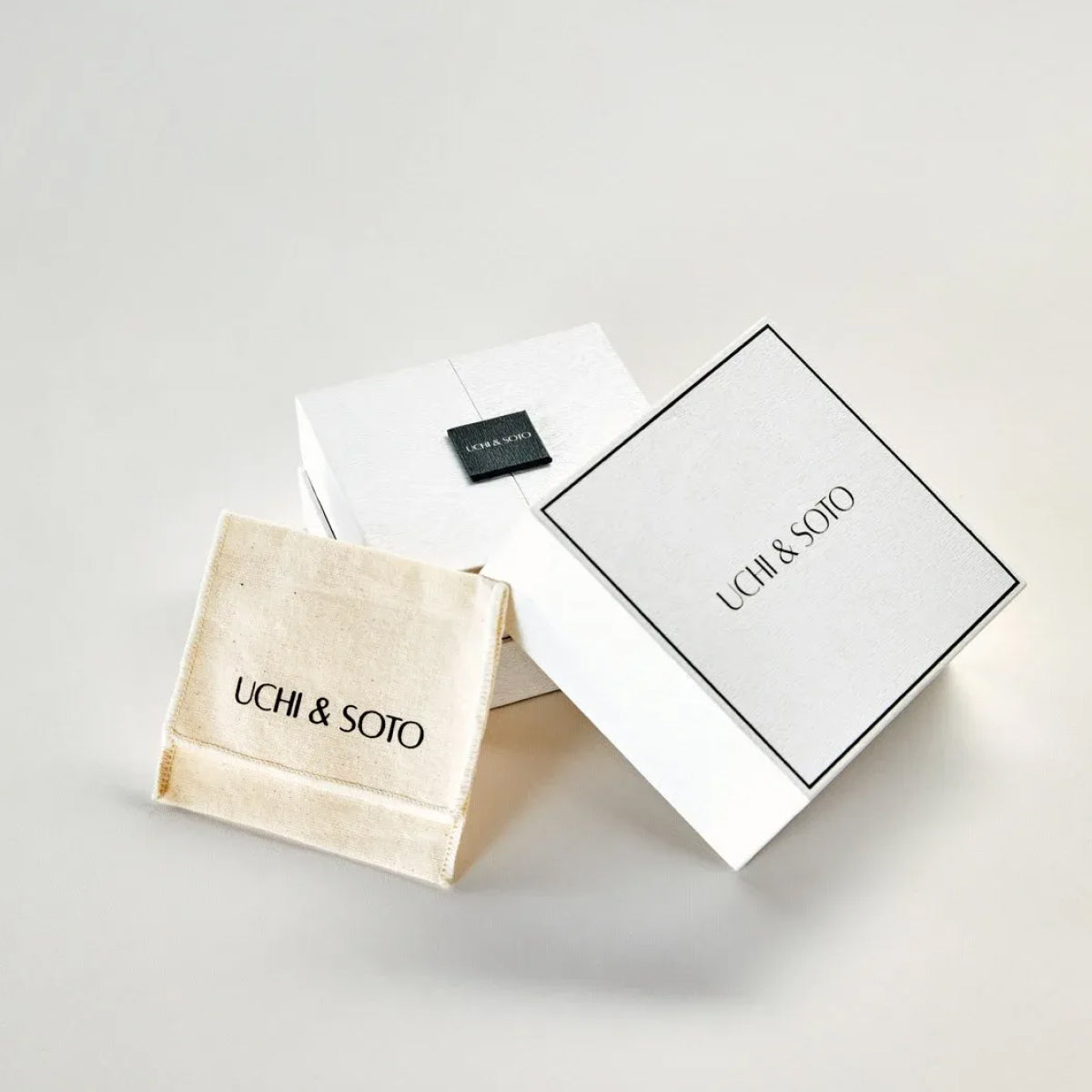 Uchi & Soto branded packaging on a light gray background