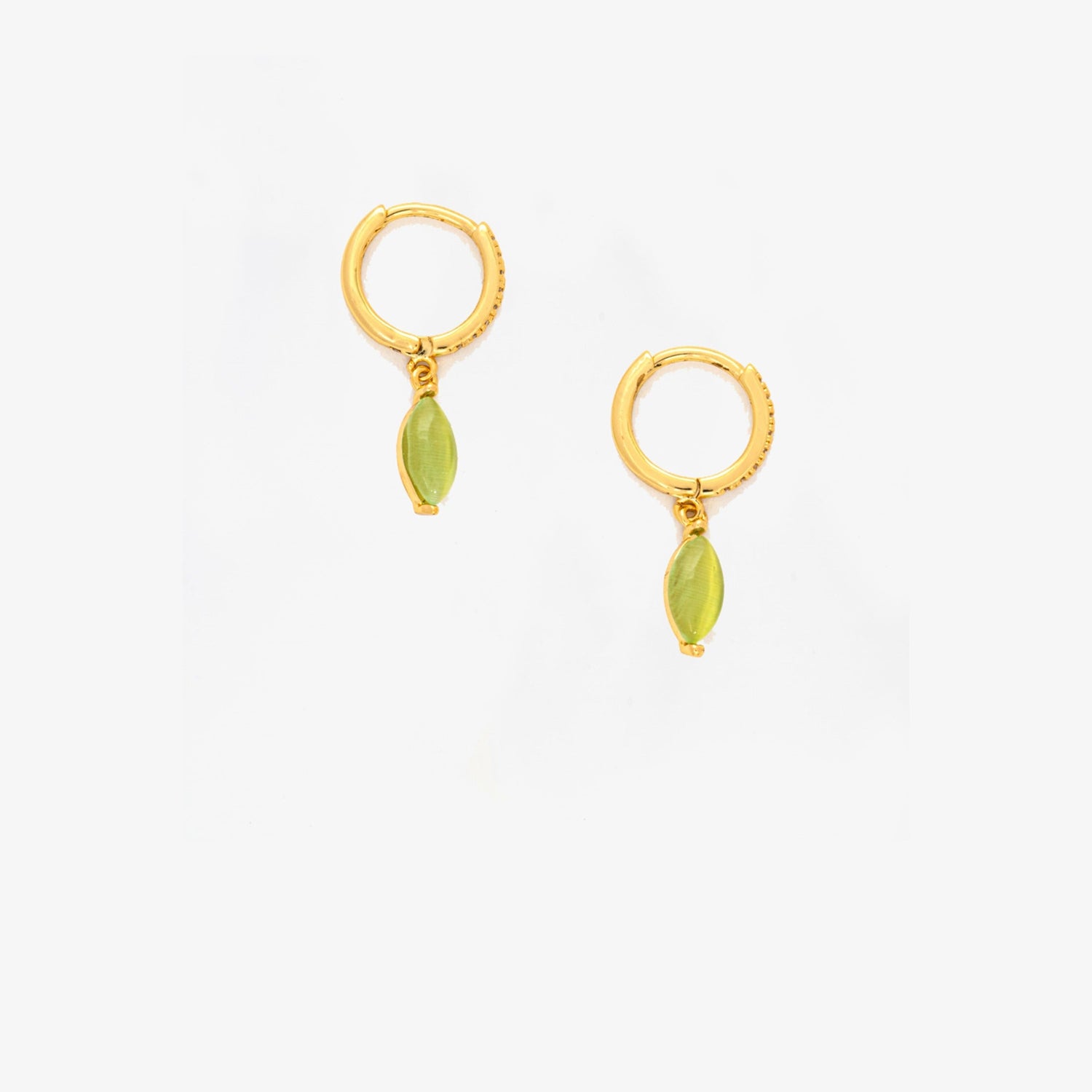 Gold hoop earrings with green gemstones on a white background