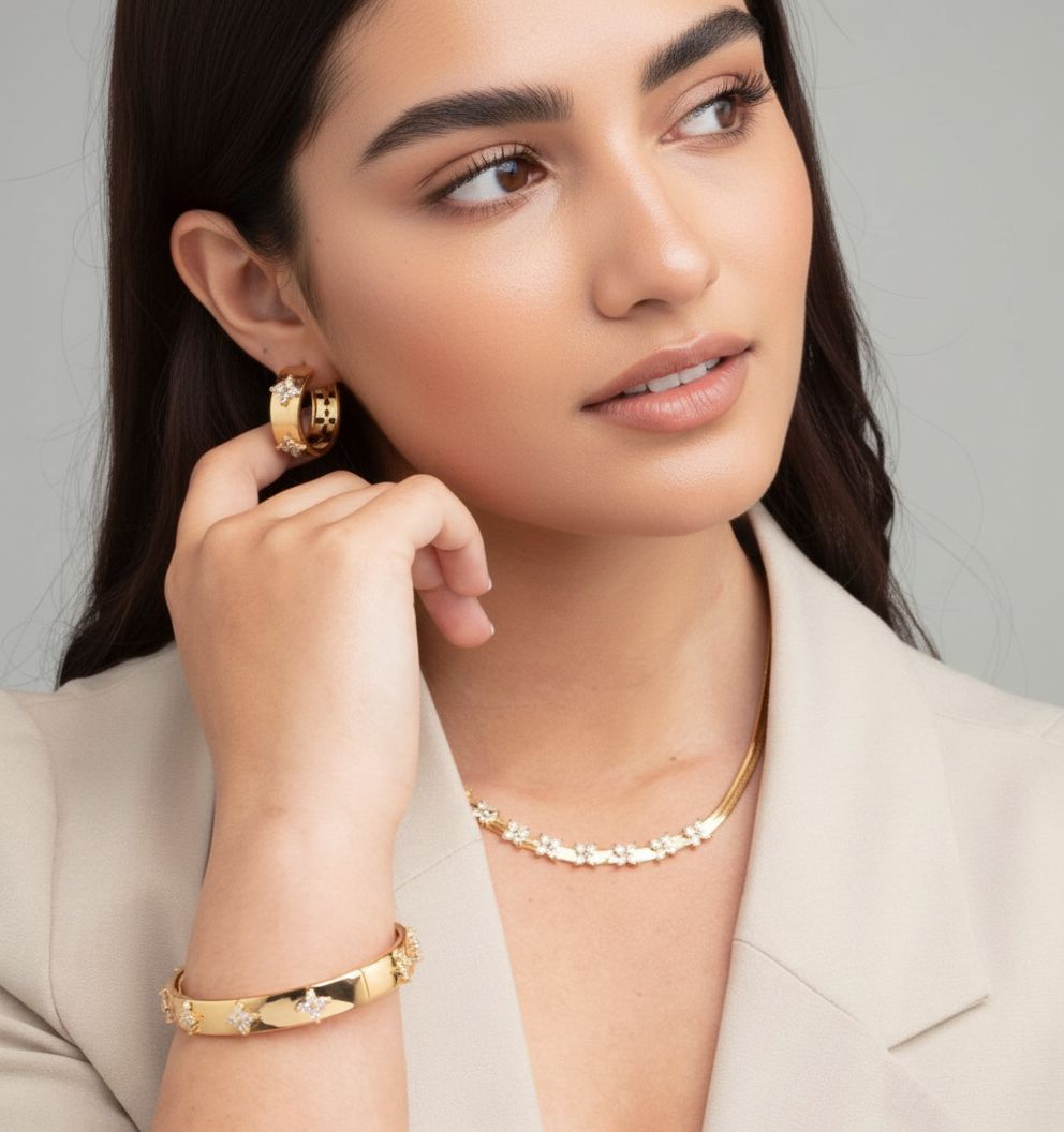 women_wearing_Gold_Floral_Hoops_earrings_and_floral_bangle_18k_gold_plated_with_cream_blazer uchi soto