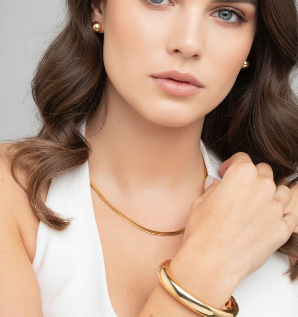 women_wearing_gold_plain_bangle_with_knot_gold_stud_earrrings_18k_gold_plated_uchi_and_soto